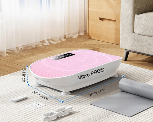 Top view of Vibro PRO® pink vibration plate with remote and power cord accessories