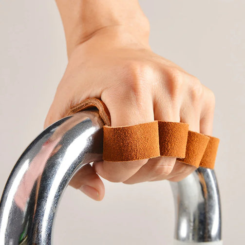 Athlete using leather lifting gloves during CrossFit training